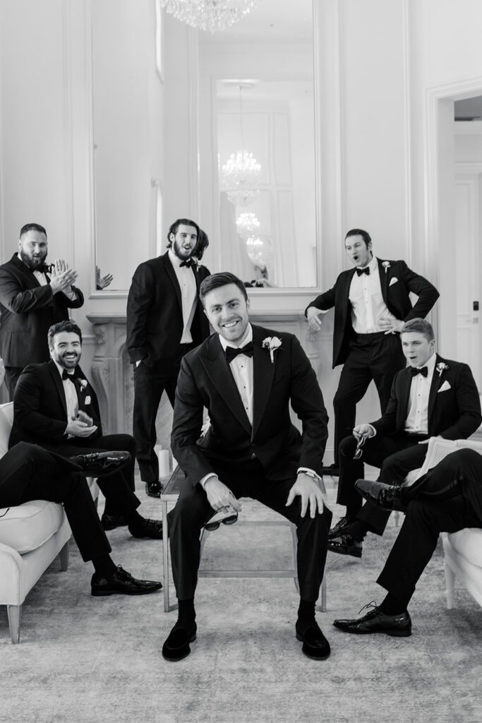 Groom Candid with Groomsmen by Carley Ann Photography